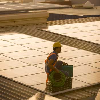 Man installing solar panels