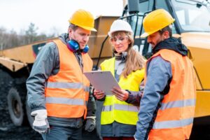 construction workers reviewing plans